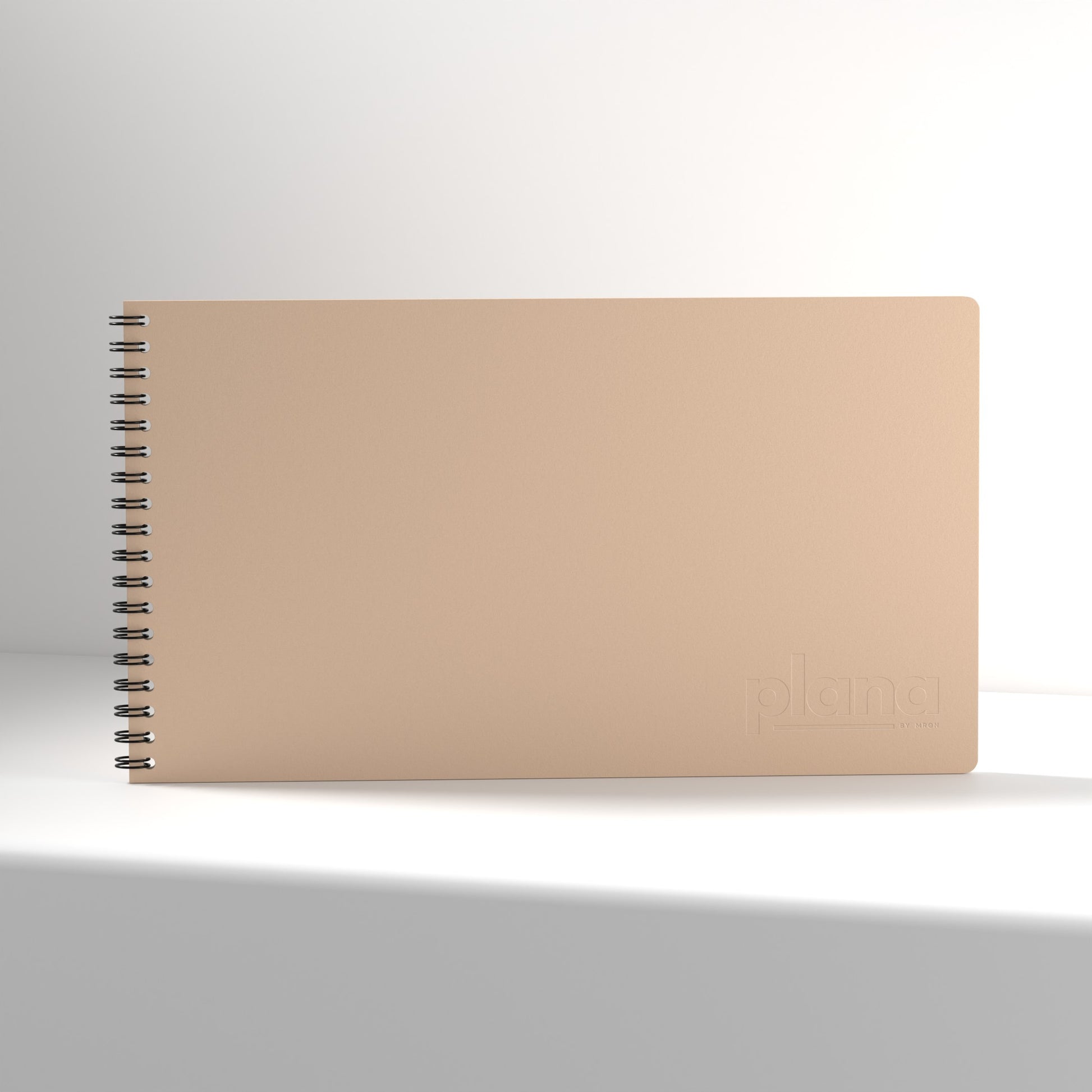 Plana Classic Blush notebook with a spiral binding on a white background