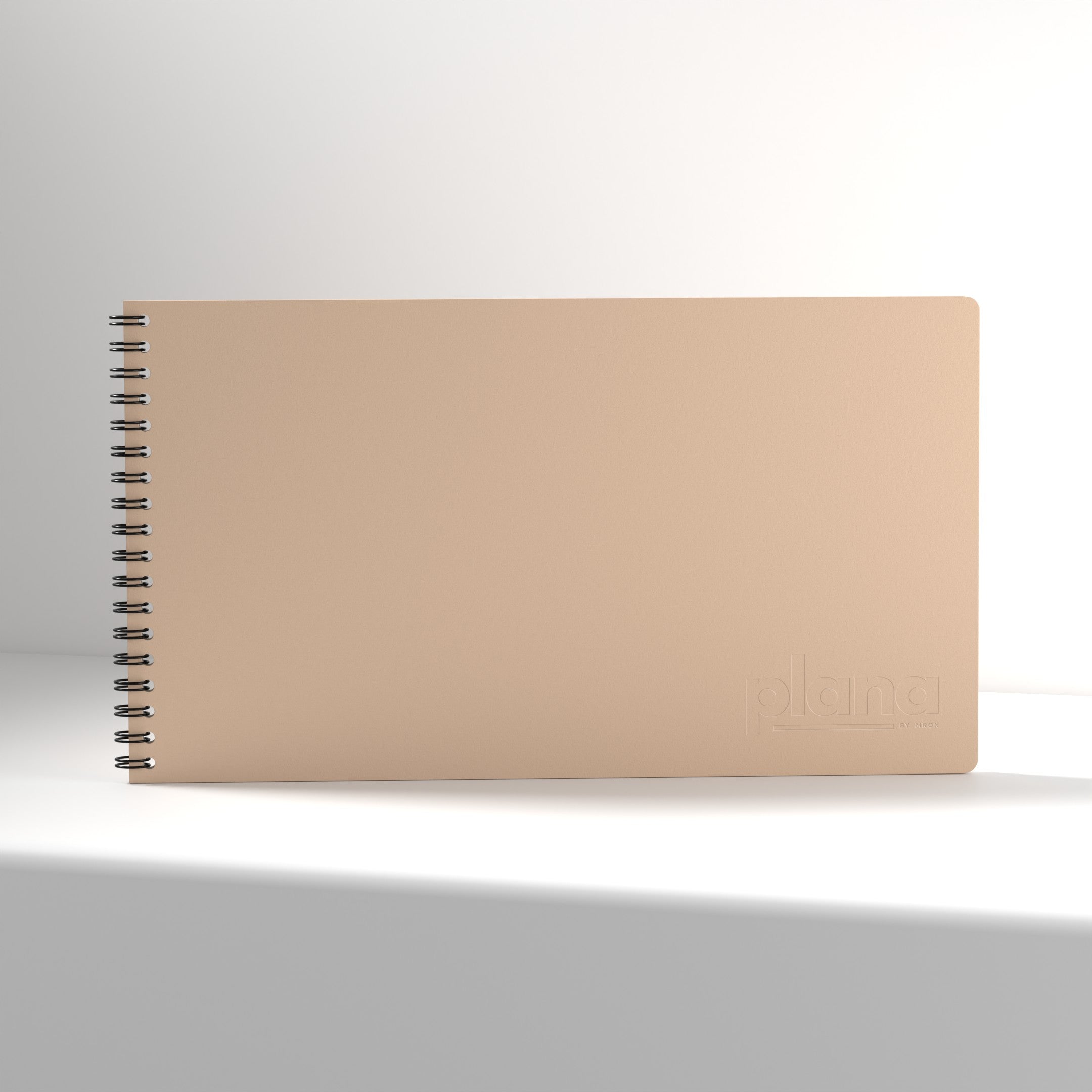 Plana Classic Blush notebook with a spiral binding on a white background