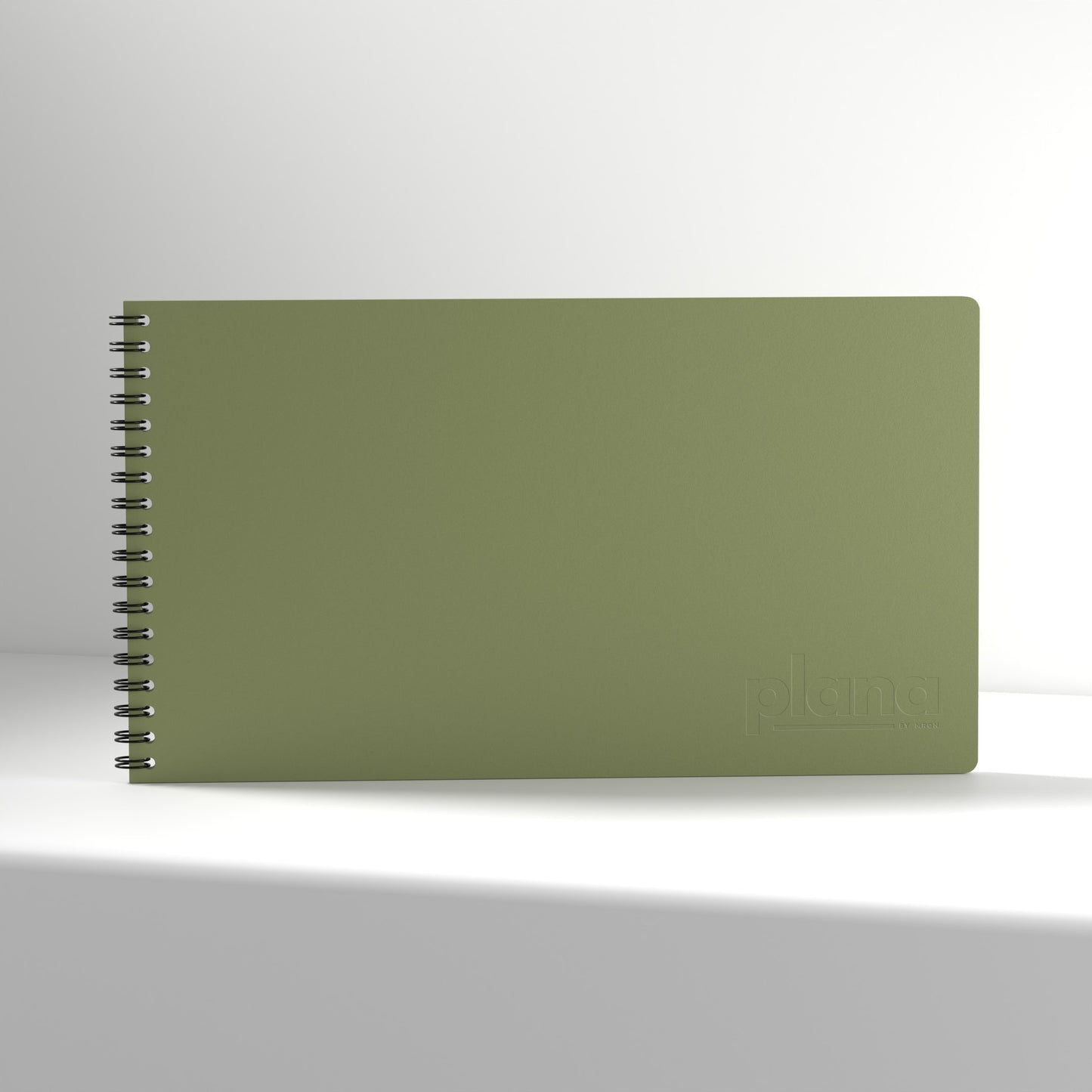 Plana Classic Cedar  notebook with a spiral binding on a white background