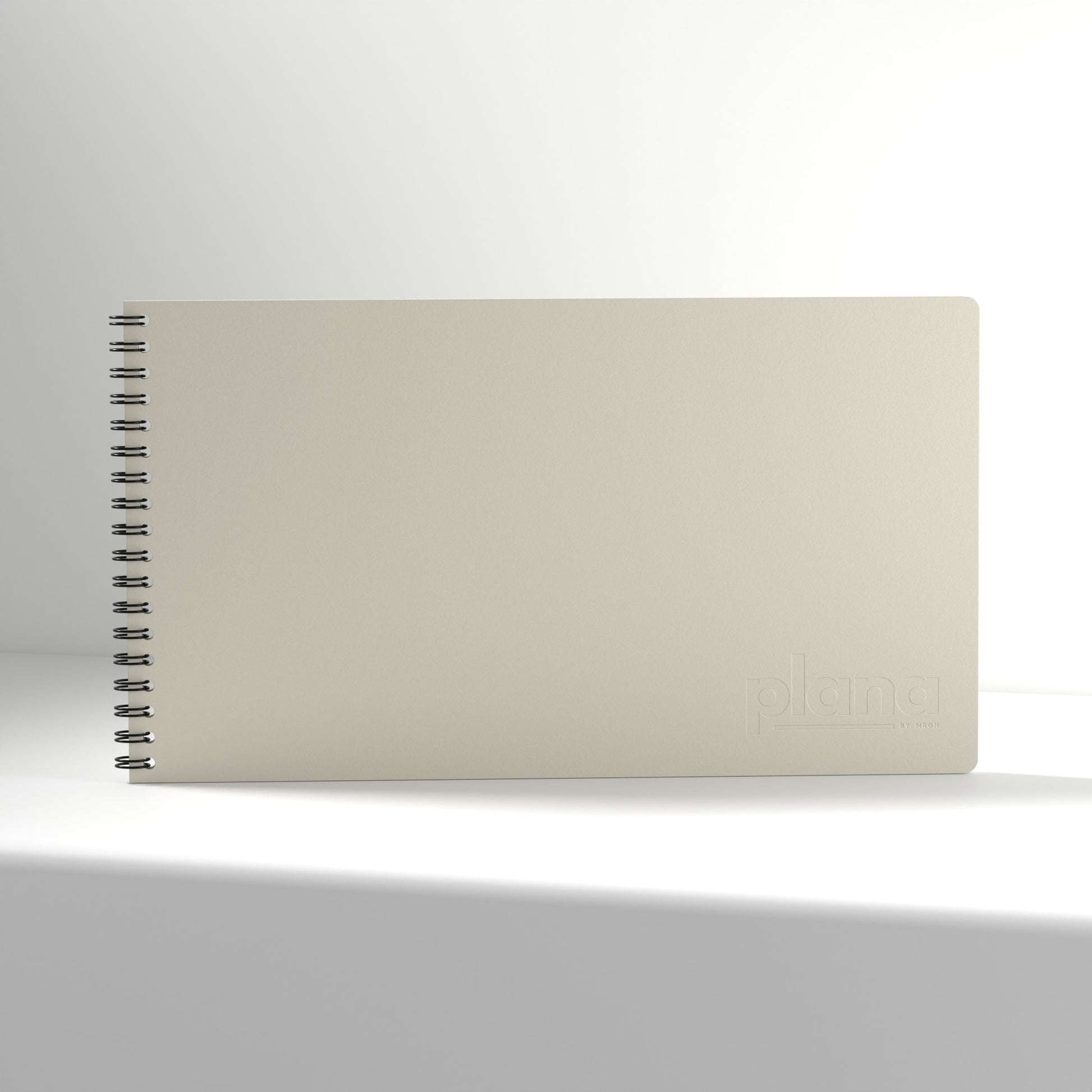 Plana Classic Fog notebook with a spiral binding on a white background
