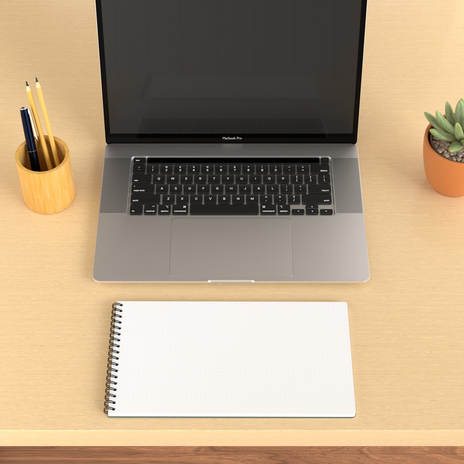 Plana Flex opened on a wooden desk with a laptop, pen holder, and plant