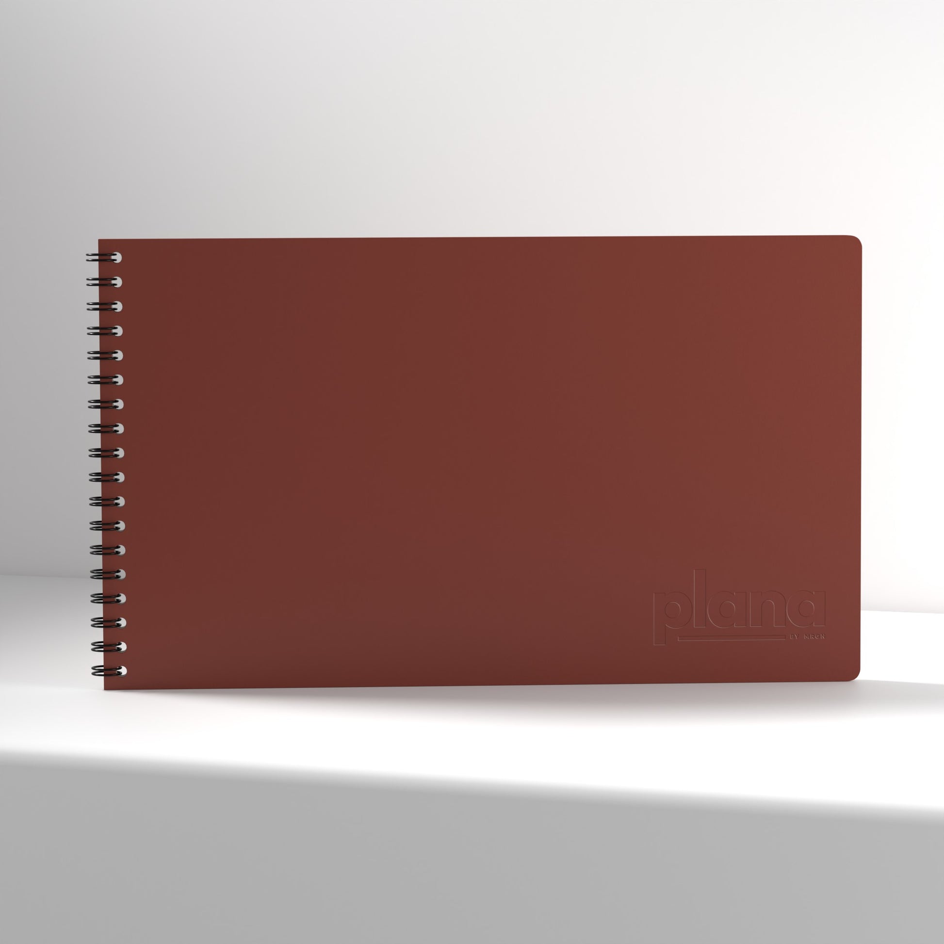 Plana Pro Garnet notebook with a spiral binding on a white background