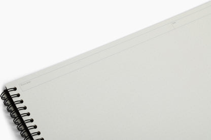 Inside pages of the Plana Pro notebook showcasing dedicated sections for Focus Area and Date on a white background